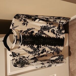 White and black print blouse, button by the neckline. Size small